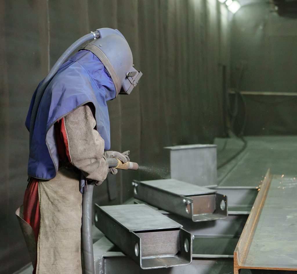 Sandblasting and abrasive surface preparation